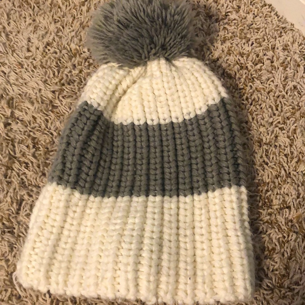 A gray and white hat